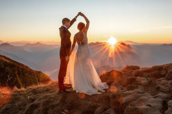 Sunset wedding photos in the alps on a mountain in austria