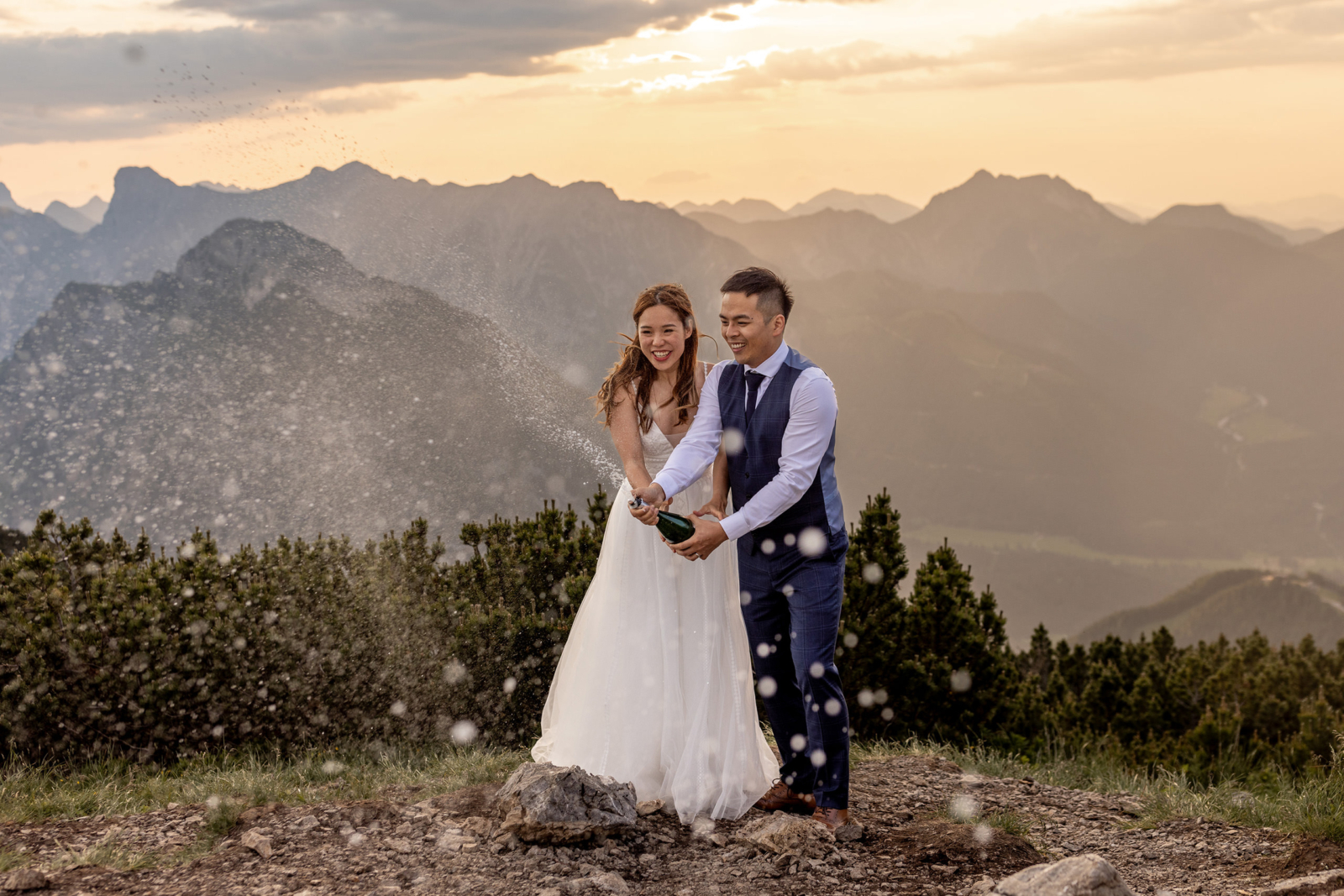 champagne pop to celebrate the mountain elopement in Austria