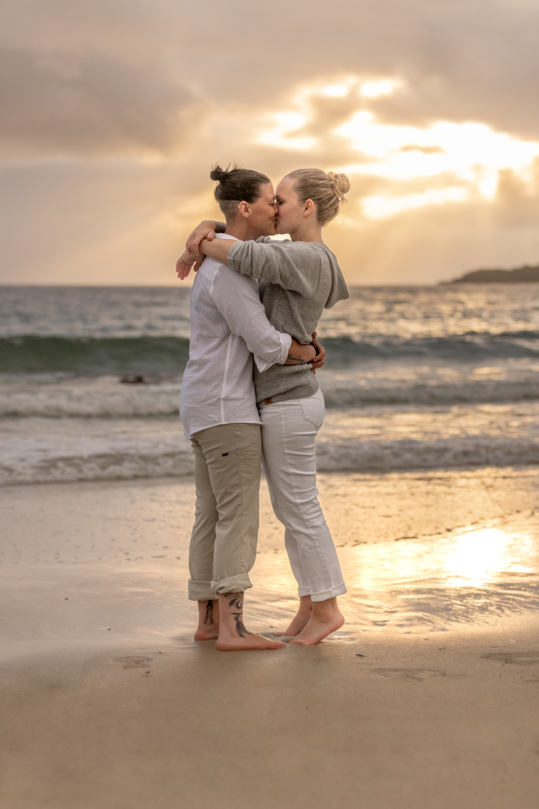 romantic engagement photos during sunset at the beach in Norway