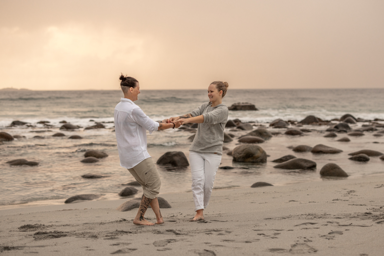 romantic engagement photos dancing at the beach in Norway