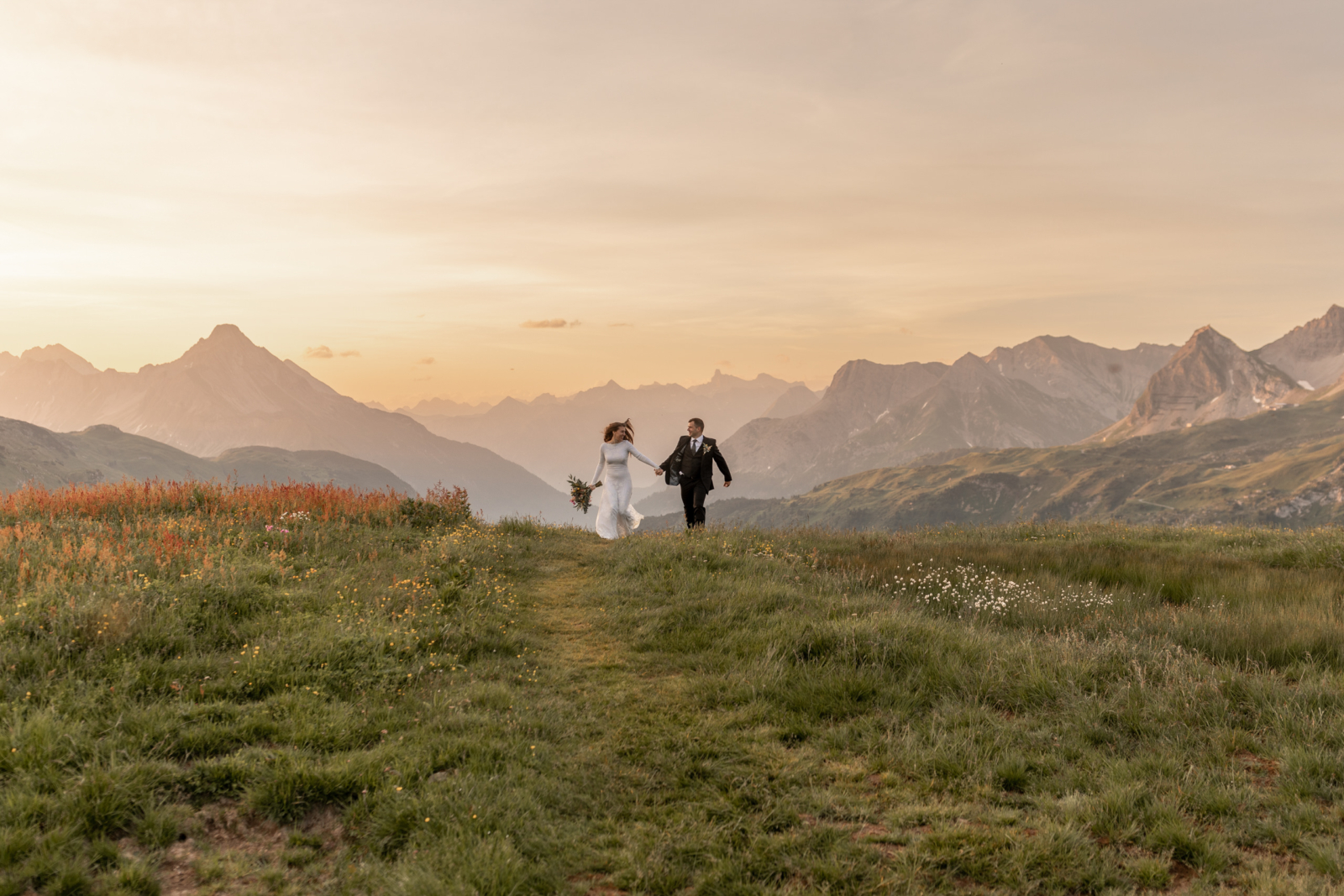 Beautiful Sunrise Wedding Amidst the Blooming Wildflowers in the Alps