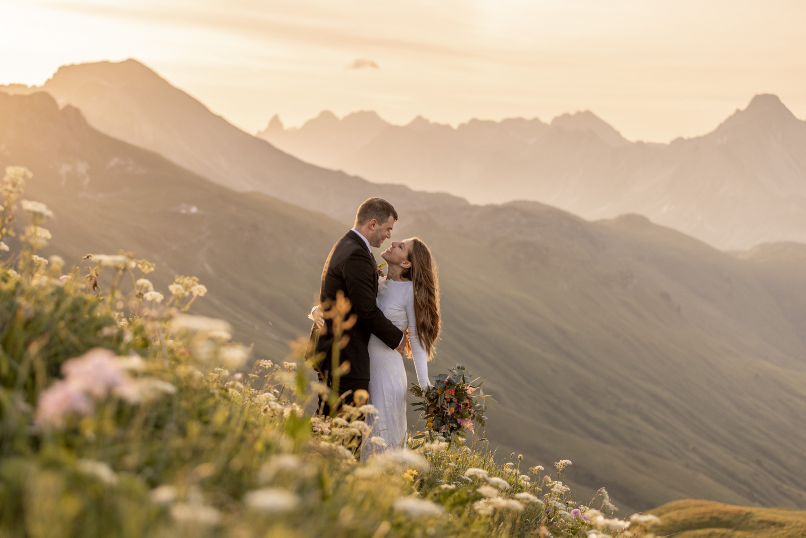 A Sunrise Wedding Amidst the Blooming Wildflowers in the Alps