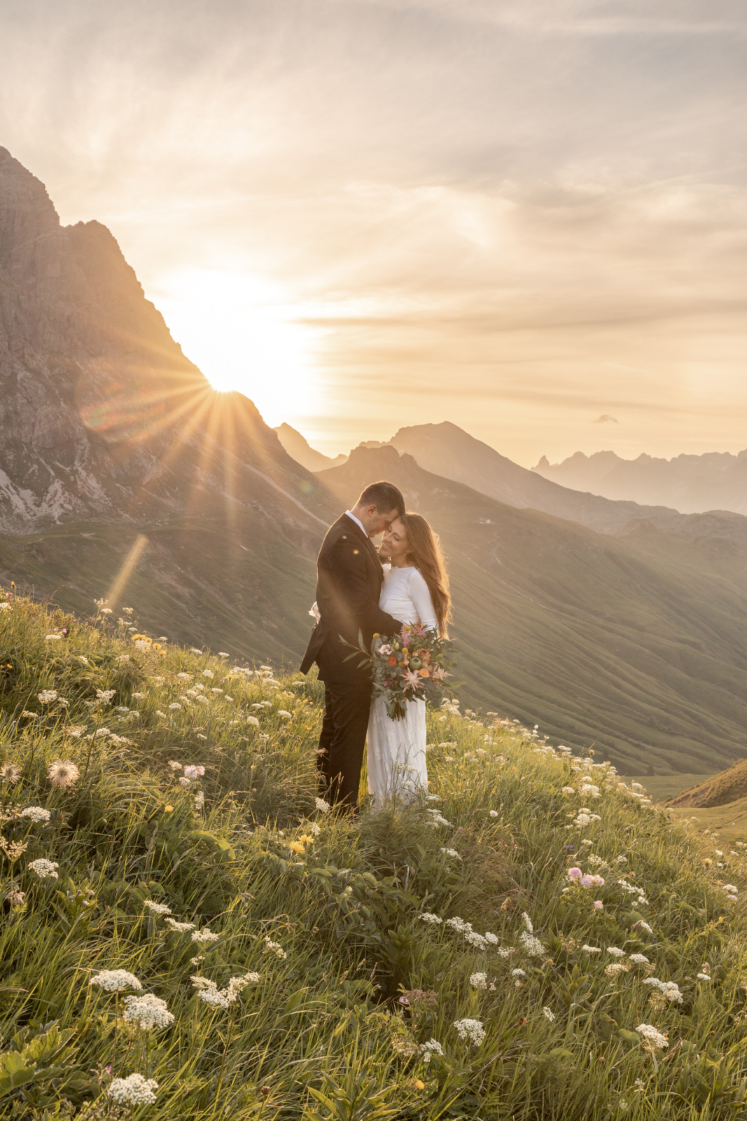 Romantic Sunrise Wedding Amidst the Blooming Wildflowers in the Alps