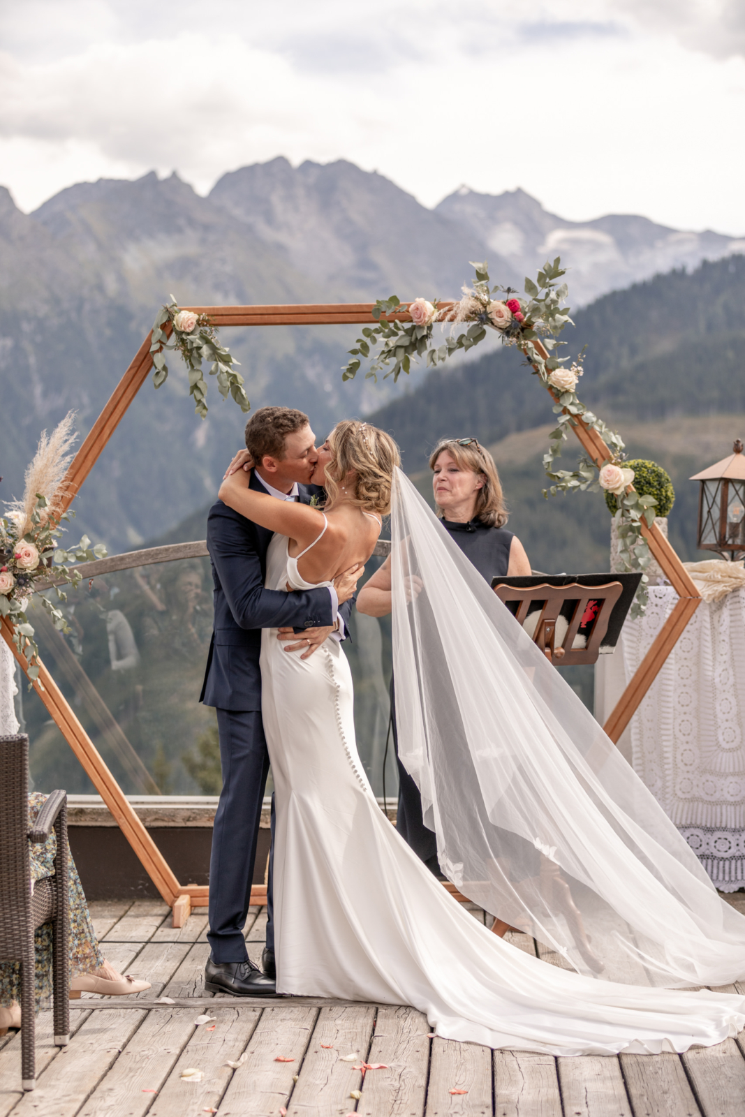 epic first kiss at the destination wedding in the mountains in Austria