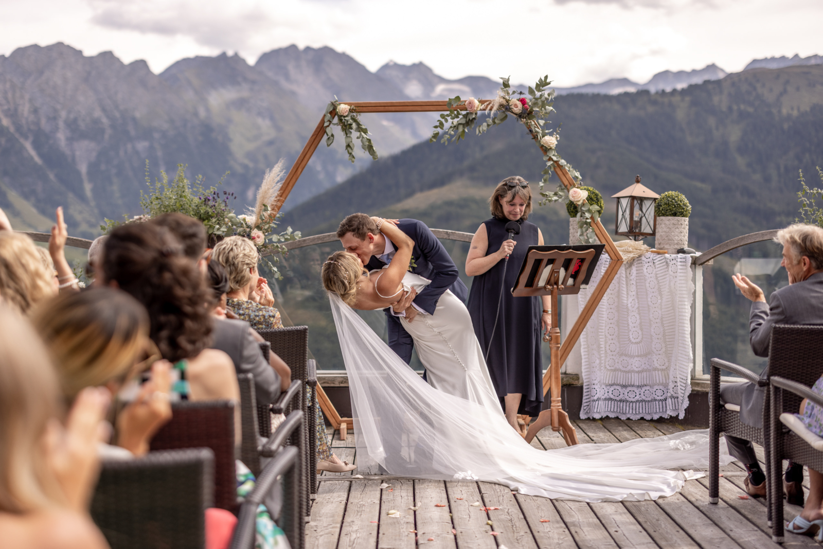 beautiful first kiss at the destination wedding in the mountains in Austria