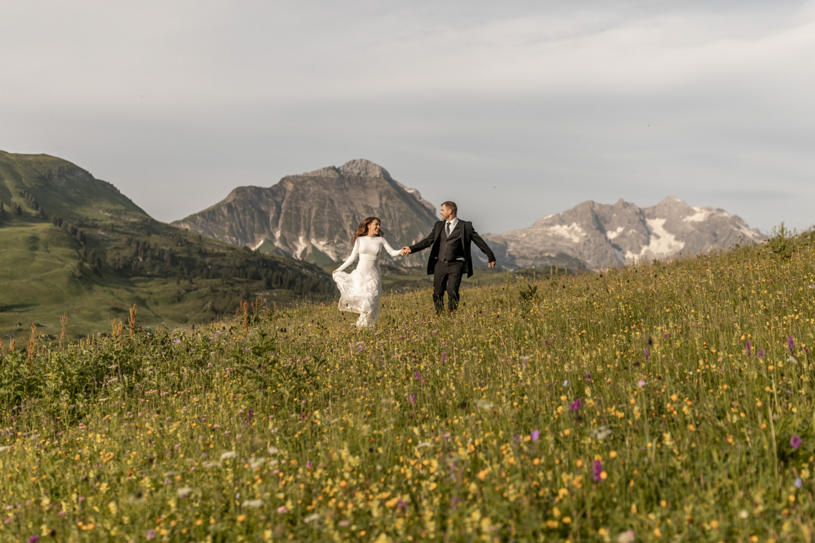 Elopement Photos Amidst the Blooming Wildflowers in the Alps