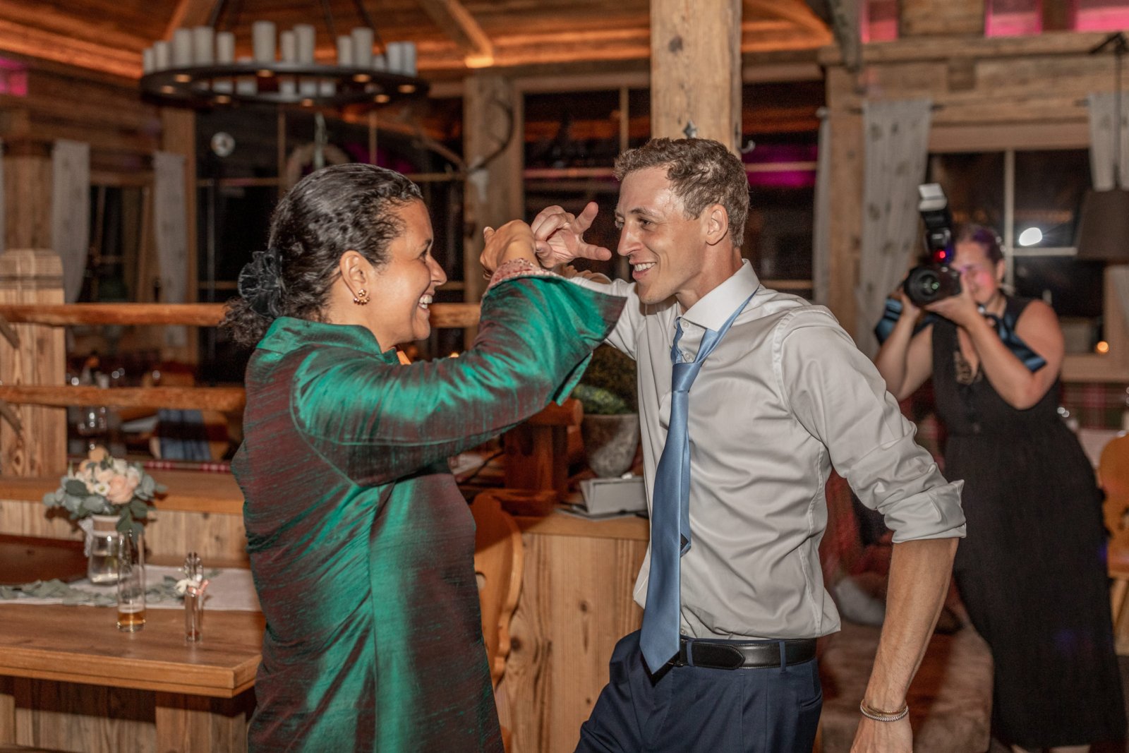 groom is dancing with his aunt