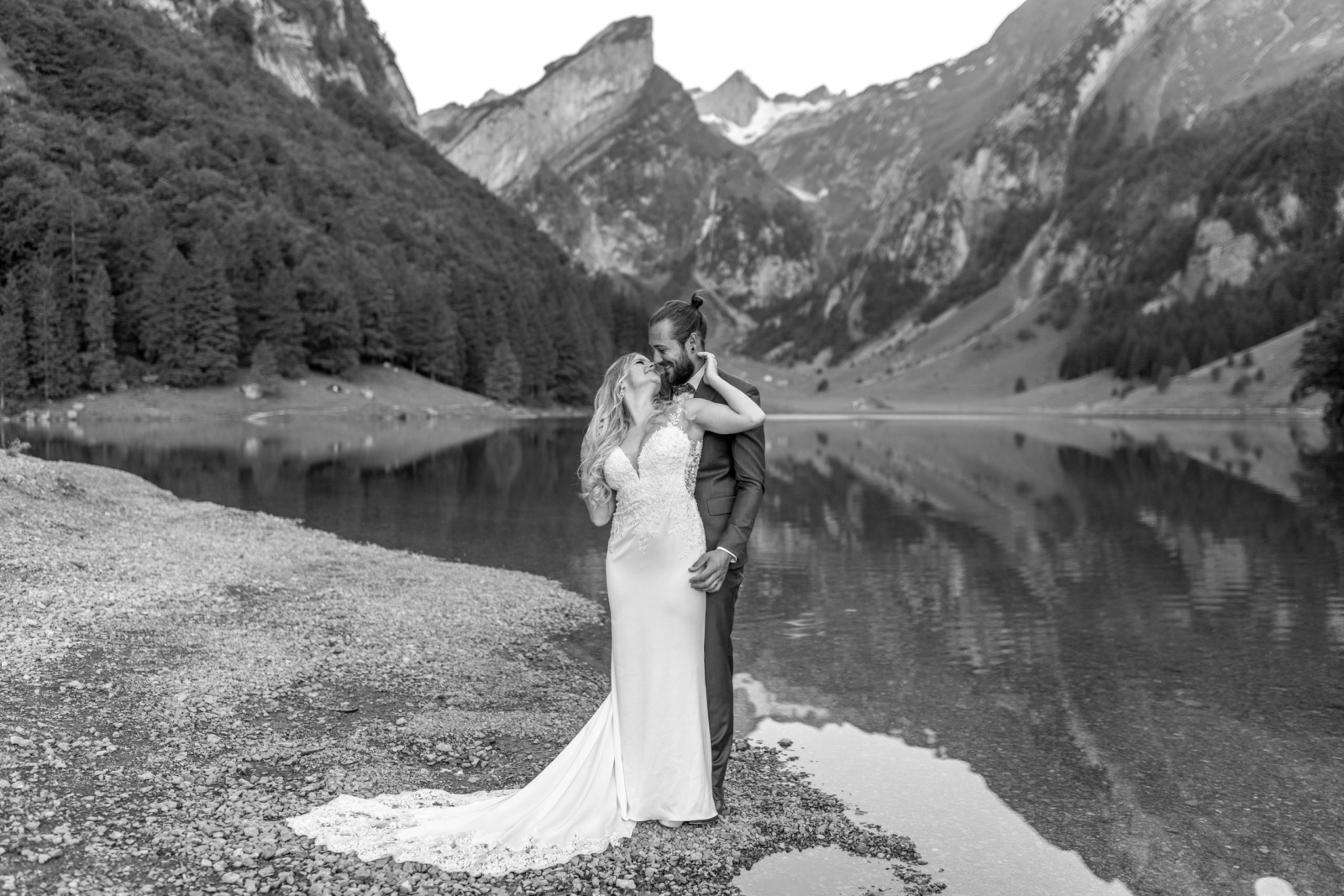 romantic black and white wedding photo at Lake Seealpsee in Switzerland