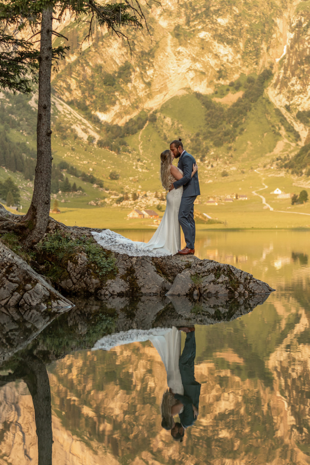 romantic kiss with reflection in an Alpine Lake
