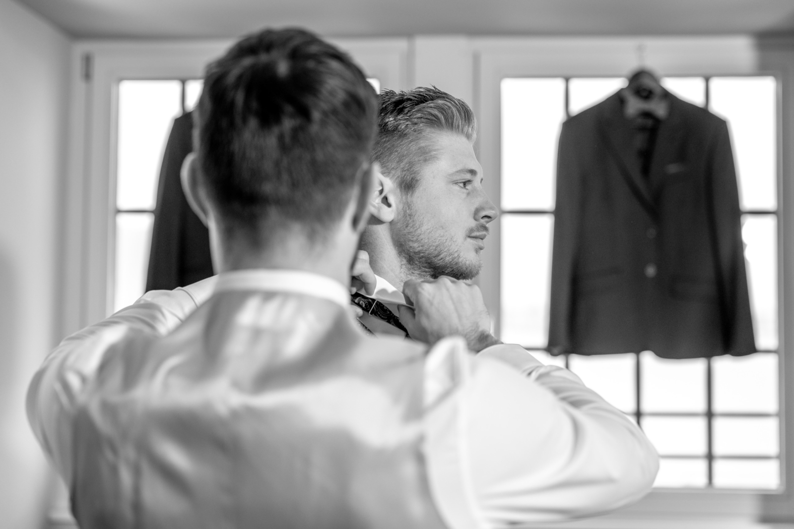 black and white - groom getting ready