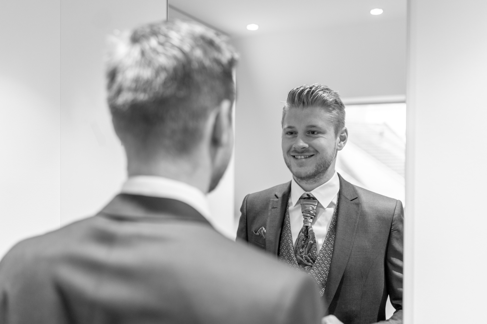 groom getting ready - black and white portrait photo